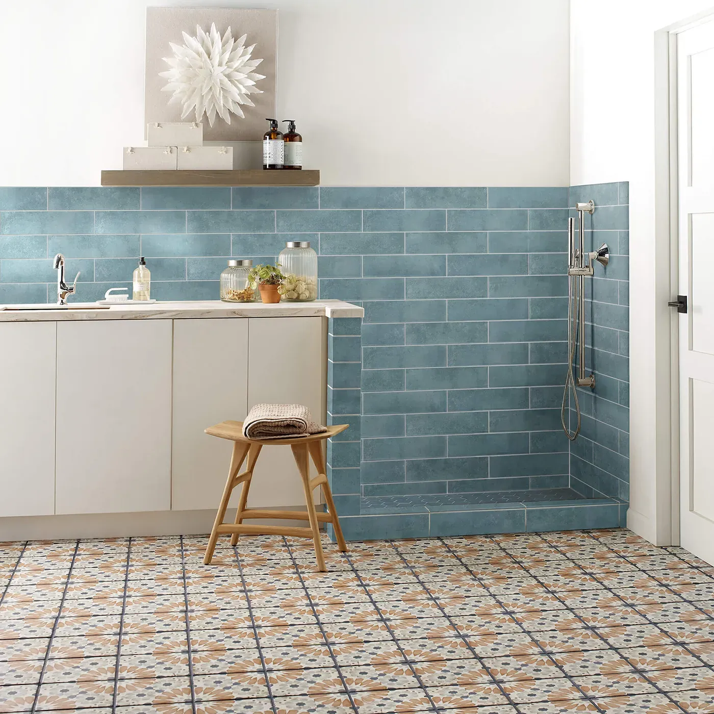 Noble-306TS-00450-Mint-3x12-RM-V Mint blue subway tile on the wall and multi-colored patterned tile on the floor | Frazee Carpet & Flooring